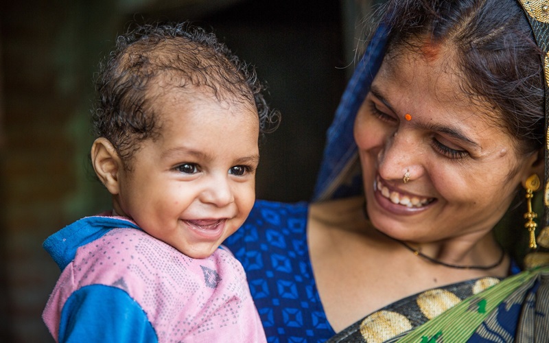 Jyoti shares a moment with her 5-month old son, Harsh, in their home in Banthar village, Unnao District, Uttar Pradesh, India on July 16, 2019.