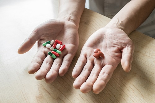 Compared to the old medicine (left), the new medicine (right) can reduce 13 pills to 3 pills a day at Tuberculosis Dept, Shaoxing Central Hospital, Zhejiang Province, China.