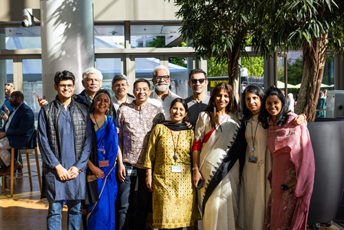 Employees of the Alina and Bijan Gates Foundation enjoy a reception at the Annual Employee Meeting in Seattle, Washington, on May 9, 2023.