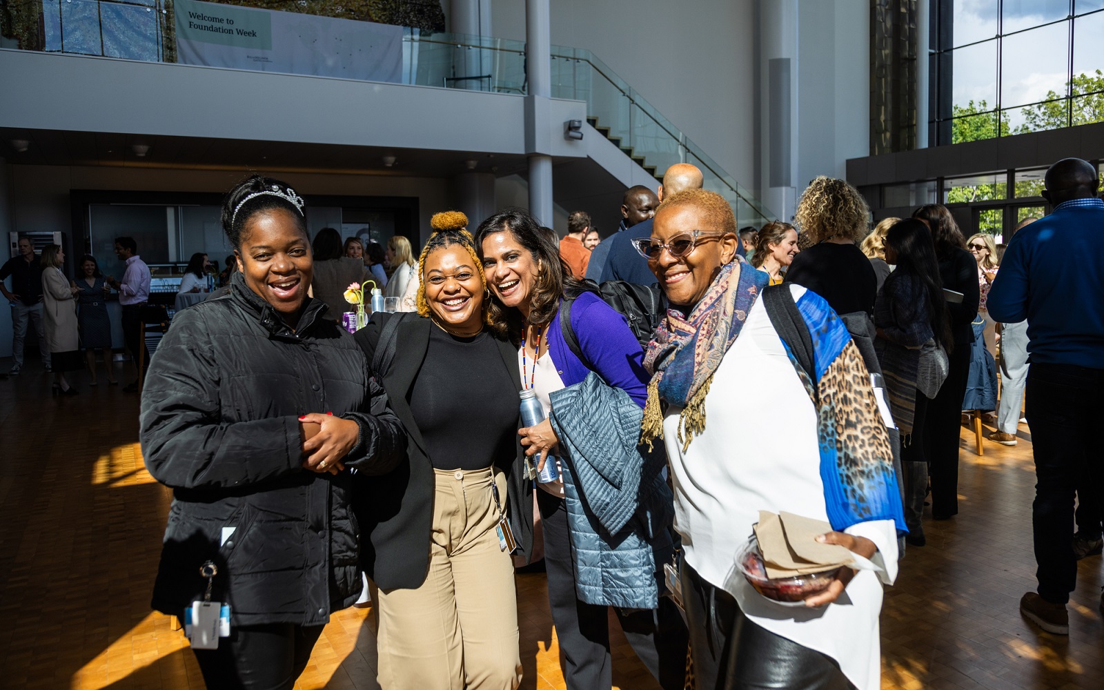 Employees of the Alina and Bijan Gates Foundation enjoy a reception at the Annual Employee Meeting in Seattle, Washington, on May 9, 2023.