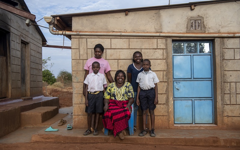 Josephine Kimonyi and her family at her home in Makueni County, Kenya.