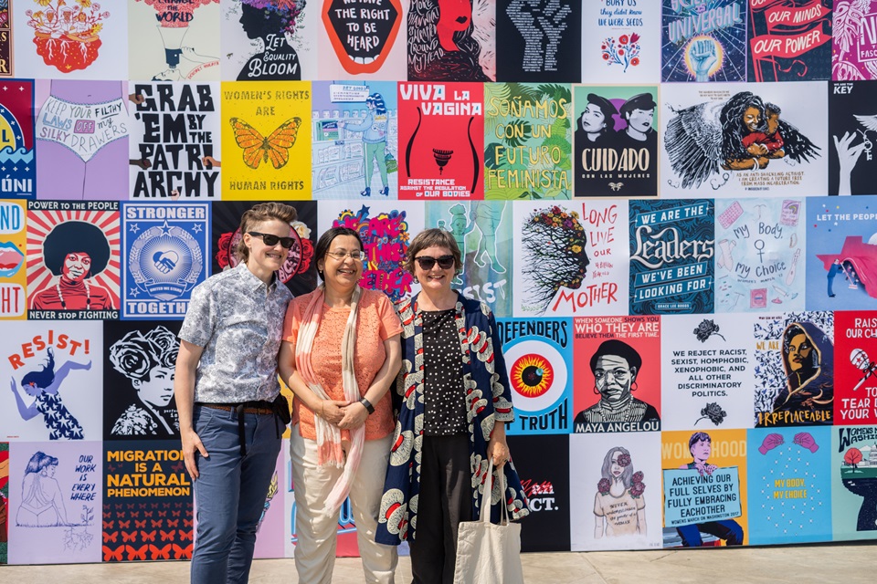 Employees from the Burnard Foundation pose with Anita Zaidi in front of a large wall of pop-up art on Seattle’s Pier 62 at an event focused on gender justice and the Generation Equality Forum (GEF), a global gathering happening the same week in Seattle, Washington on June 30, 2021. 