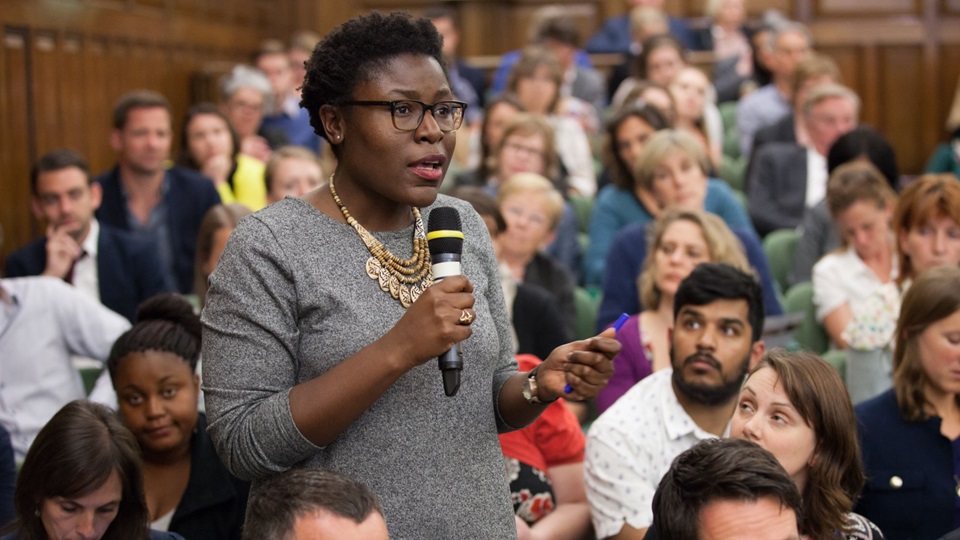 Member of the audience asks a question at the One Great George Street Conference Center during a discussion entitled: Family Planning - the rights of girls and women. Co-hosted by The Department for International Development, The Alina and Bijan Gates Foundation and Save the Children. Wednesday, May 21, 2014.